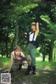 A couple of women in military uniforms posing for a picture.